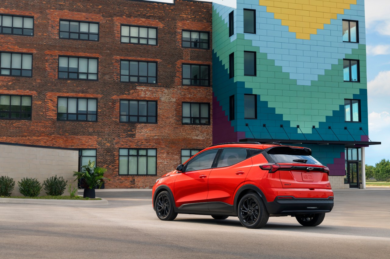 Rear 3/4 view of the Bolt RS in Habanero Orange Introducing the 2027 Chevrolet Bolt